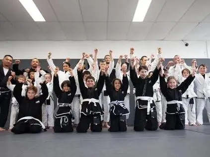 Children participating in a Brazilian Jiu Jitsu class at Alpha Jiu Jitsu Academy Rouse Hill, focusing on skill-building and teamwork.